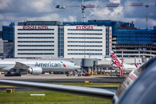 an american airlines plane on the runway at an airport at Rydges Sydney Airport Hotel in Sydney