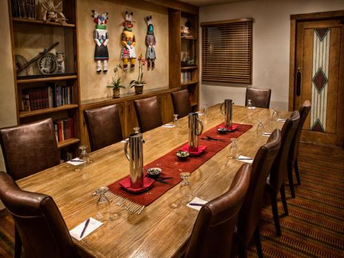 a conference room with a long wooden table and chairs at Hotel Santa Fe in Santa Fe