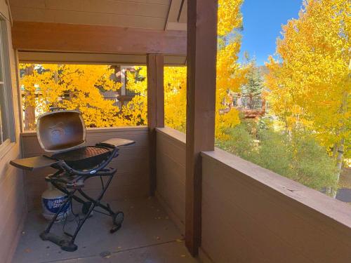 a small room with a chair in front of a window at Aussie Elegance at Slopeside in Silverthorne