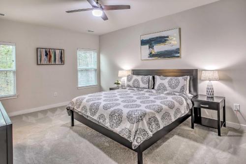 a bedroom with a bed and a ceiling fan at N Myrtle Beach Townhome Near Barefoot Resort! in North Myrtle Beach