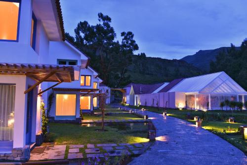 a house with a pathway leading to it at night at Aranwa Pueblito Encantado del Colca in Coporaque