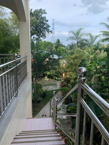 a view from the balcony of a house at Soul Travellers Dagatan Guesthouse in Badian