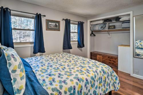 Кровать или кровати в номере Pigeon Forge Cabin with Private Hot Tub and Gas Grill