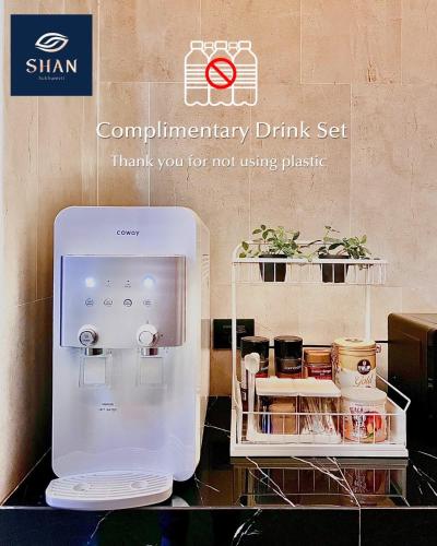 a complimentary drink set is on display in a store at SHAN Villas Sukhumvit in Bangkok