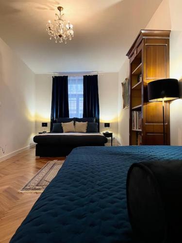 a living room with a bed and a couch at historical Zaffir house - market square in Levoča