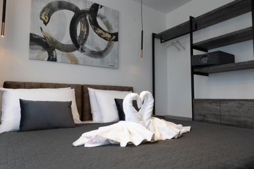 Ένα ή περισσότερα κρεβάτια σε δωμάτιο στο Apartmani Mozart-centar Virovitica