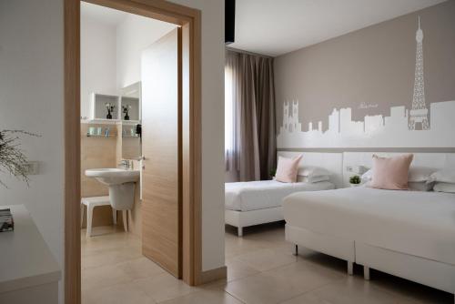 Postel nebo postele na pokoji v ubytování Castello D'Argile Hotel