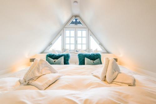 Ένα ή περισσότερα κρεβάτια σε δωμάτιο στο Haus Steghüs