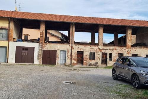 a car parked in front of a brick building at My House&Apartments in Agrate Brianza