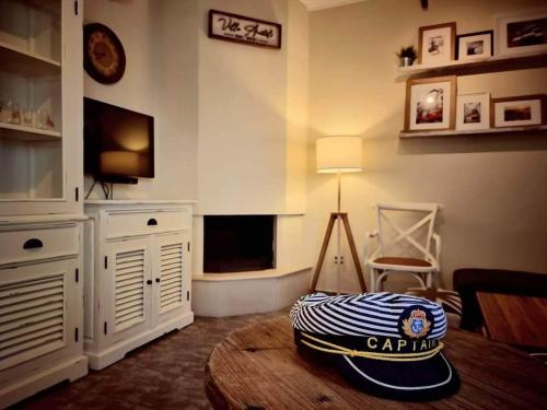 a living room with a room with a carlilventoryventoryventory at Seascape Villas Kinira - Elia & Anatoli in Kinira
