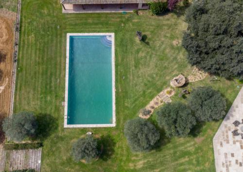 an aerial view of a swimming pool in a yard at Finca Mas Gotas Costa Brava - BY EMERALD STAY in Vall-Llobrega