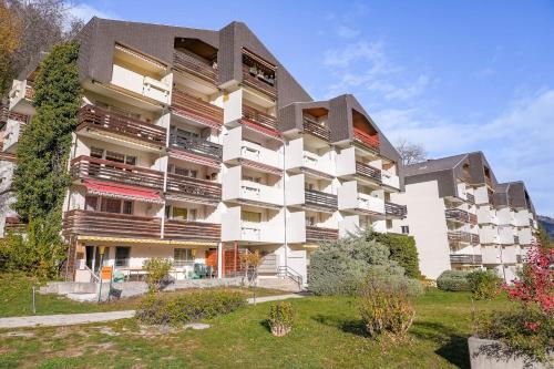 an apartment building with balconies on the side of it at Im Grünen B225 in Mörel