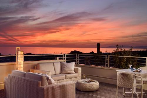 a living room with a view of the ocean at Versilia Lido | UNA Esperienze in Lido di Camaiore