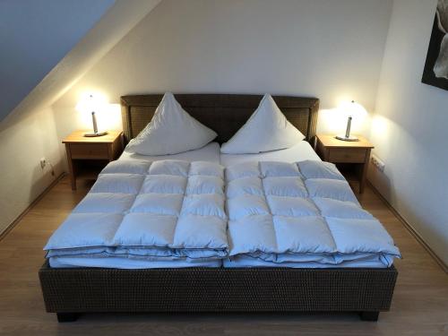 Postel nebo postele na pokoji v ubytování Strandstr_