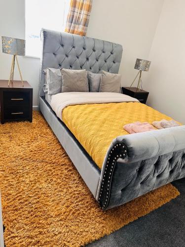 a bedroom with a bed with a metal frame at City Blessed Aptm 3 with Free Parking in North Shields