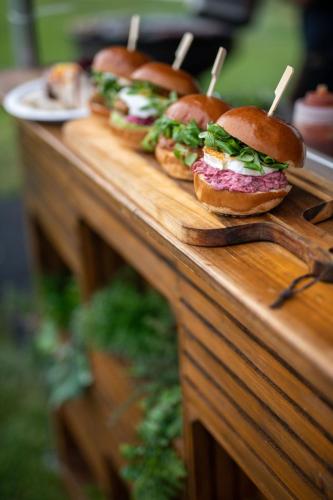 a group of sandwiches on a wooden table at GPtents in SPA in Spa