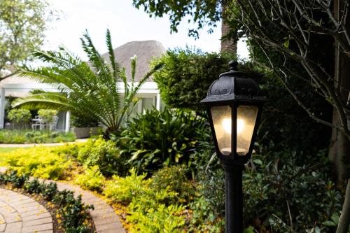 a street light in front of a house at Cape Village Lodge in Durbanville
