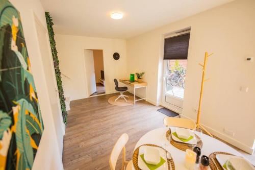 a room with a table and chairs and a desk at Lovely 3 Bedroom Apartment in Eindhoven 65m2 - SD23N in Eindhoven