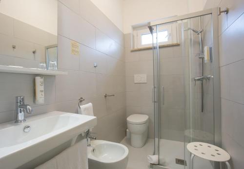 a bathroom with a sink toilet and a shower at Villa Nazareth Fermo in Fermo