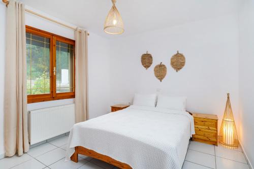 Postel nebo postele na pokoji v ubytování Dalgiannaki Home