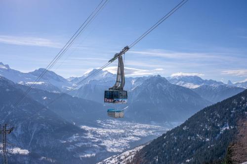 a ski lift in the middle of a mountain at Chalet Elsa in Riederalp