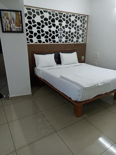 Кровать или кровати в номере Padilgate Luxuryinn