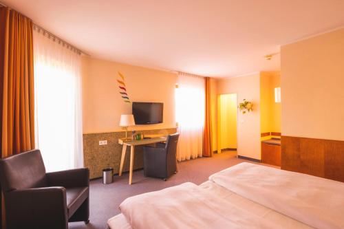 Postel nebo postele na pokoji v ubytování Hotel Luise