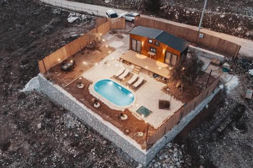 an aerial view of a house with a swimming pool at Olive Garden Tiny House in Kumluca