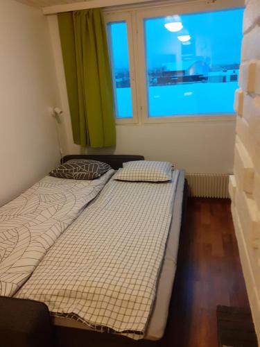 Postel nebo postele na pokoji v ubytování Rovaniemi City Penthouse