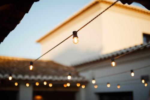 a string of lights hanging in front of a house at The Adelante House in Jávea
