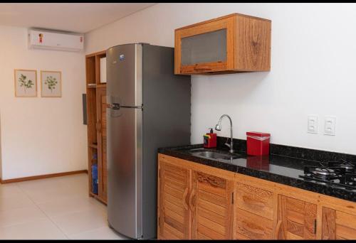 Dapur atau dapur kecil di Flat Vila Taipu