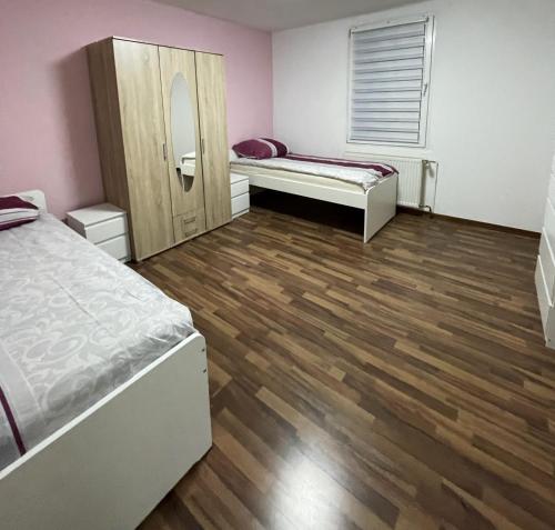 a room with two beds and a mirror at 4-Zimmer Wohnung in Wuppertal 6 Personen in Wuppertal