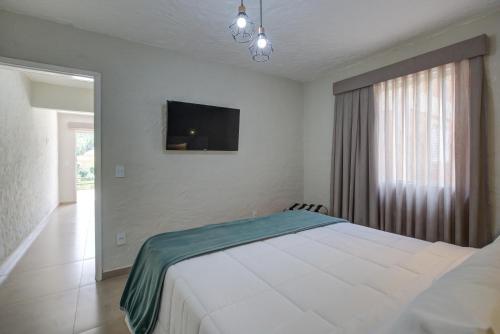 Postel nebo postele na pokoji v ubytování Filimahalo Hotel