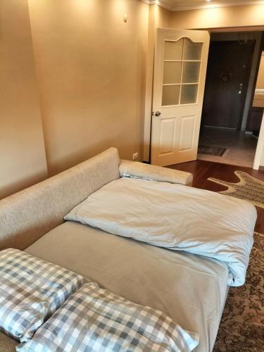 two beds in a room with a door at Room Mate Room Suite in Istanbul