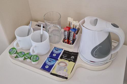 a counter with a blender and other items on it at The George Hotel in Battle