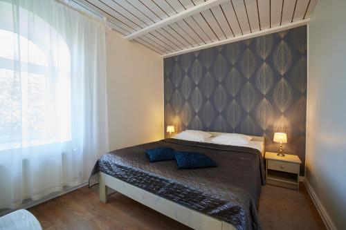 Voodi või voodid majutusasutuse Hotell Wesenbergh toas