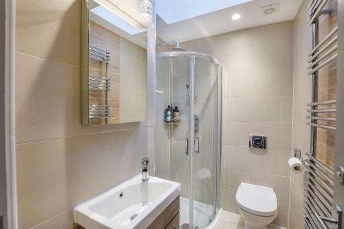 a bathroom with a shower and a sink and a toilet at The Wesley in York