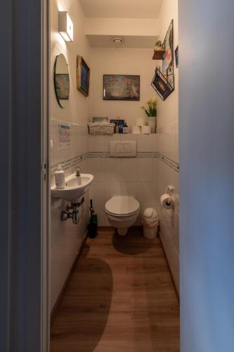 a bathroom with a toilet and a sink at Apartment Casino in Nieuwpoort