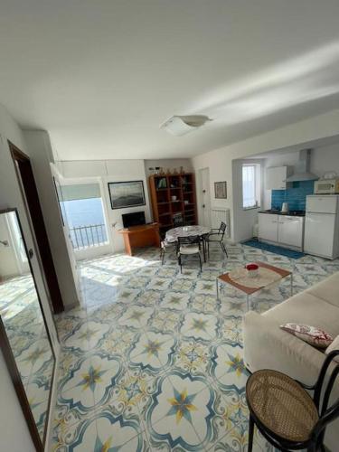 a living room with a couch and a table at Villa sul mare in Massa Lubrense