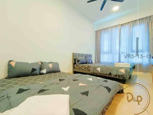 a bedroom with two beds and a ceiling fan at VR31313-2BR 6Pax SUNWAY VELOCITY SHOPPING MALL KL in Kuala Lumpur