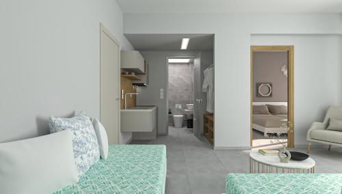 a living room with a couch and a bathroom at Ninemia Beach Hotel & Suites in Agia Marina Nea Kydonias