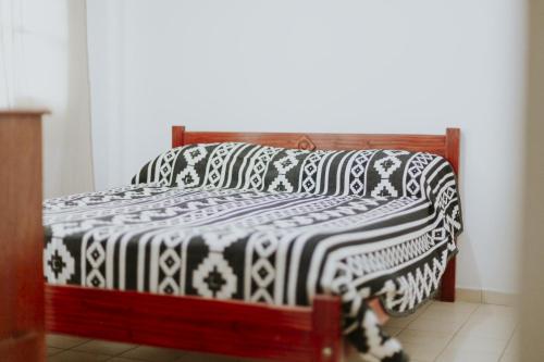 Una cama o camas en una habitación de Leguizamon Flat - MZA Travel