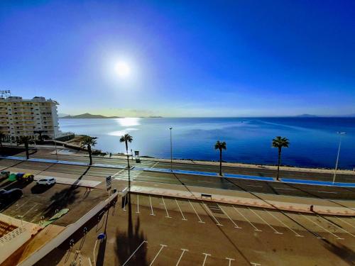 a view of the ocean from a parking lot at Casa en Urbanización Los Ibicencos in La Manga del Mar Menor