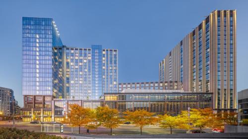 a group of tall buildings in a city at Omni Boston Hotel at the Seaport in Boston