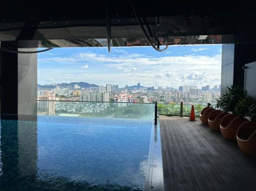 a swimming pool with a view of a city at EmEx Luxurious stay T2U29 in Kuala Lumpur