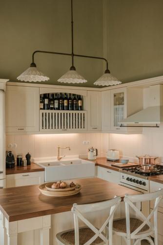 a kitchen with a table with a plate of fruit on it at Villa Comi in Mavráta