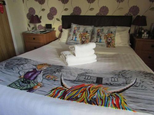 Katil atau katil-katil dalam bilik di Hunters Lodge Hotel
