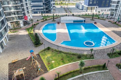an overhead view of a swimming pool in a city at The Grandeur Hotel in Batumi
