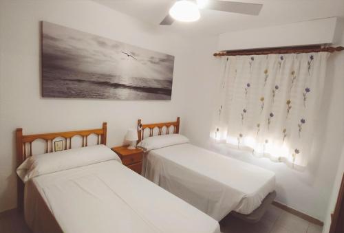 Postel nebo postele na pokoji v ubytování Apartamento Cumbremar superior Orange Costa