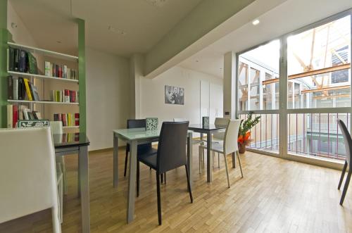 a dining room with a table and chairs at Siena Gallery - Rooms Only in Siena